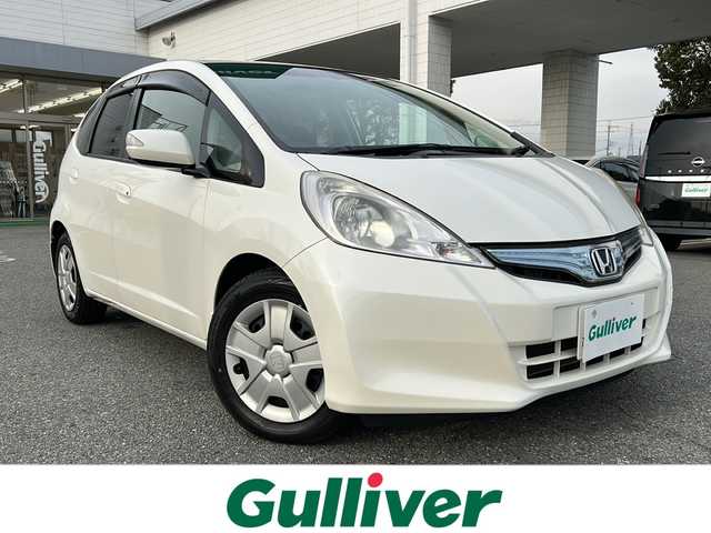 ホンダ フィット ハイブリット スマート セレクション 兵庫県 2011(平23)年 8.4万km プレミアムホワイトパール 社外ナビ（ワンセグ/FM/AM//Bluetooth）/スマートキー/クルーズコントロール/ＥＴＣ/ＵＳＢ/純正フロアマット/ステアリングリモコン/オートライト/ドアバイザー