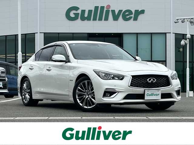 日産 スカイライン ハイブリッド 350GT Type P 佐賀県 2019(平31)年 6.4万km ブリリアントホワイトパール 純正8型ナビゲーション/・AM/FM/BT/CD/DVD/フルセグ//・インテリジェントアラウンドビューモニター/・黒革シート/・パワーシート「運転席/助手席」/・シートヒーター/・イージーエントリー＆イージーエグジット機能/LEDヘッドライト/・オートマチックハイビーム/純正18インチアルミホイール/フロアMTモード付/スマートキー/純正フロアマット/純正ドアバイザー/新車保証書/取扱説明書/スペアキー1本/ETC/インテリジェントセーフティー/・インテリジェント エマージェンシーブレーキ/・インテリジェント クルーズコントロール（全車速追従）/・インテリジェント LI/・LDW（車線逸脱警報）/・BSW（後側方車両検知警報）/・BCI（後退時衝突防止支援システム）/・MOD（移動物検知機能付アラウンドビューモニター）/・インテリジェント ドライビングアシスト/・踏み間違い衝突防止アシスト/・前方衝突予測警報（PFCW）/・ふらつき警報