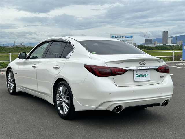日産 スカイライン ハイブリッド 350GT Type P 佐賀県 2019(平31)年 6.4万km ブリリアントホワイトパール 純正8型ナビゲーション/・AM/FM/BT/CD/DVD/フルセグ//・インテリジェントアラウンドビューモニター/・黒革シート/・パワーシート「運転席/助手席」/・シートヒーター/・イージーエントリー＆イージーエグジット機能/LEDヘッドライト/・オートマチックハイビーム/純正18インチアルミホイール/フロアMTモード付/スマートキー/純正フロアマット/純正ドアバイザー/新車保証書/取扱説明書/スペアキー1本/ETC/インテリジェントセーフティー/・インテリジェント エマージェンシーブレーキ/・インテリジェント クルーズコントロール（全車速追従）/・インテリジェント LI/・LDW（車線逸脱警報）/・BSW（後側方車両検知警報）/・BCI（後退時衝突防止支援システム）/・MOD（移動物検知機能付アラウンドビューモニター）/・インテリジェント ドライビングアシスト/・踏み間違い衝突防止アシスト/・前方衝突予測警報（PFCW）/・ふらつき警報