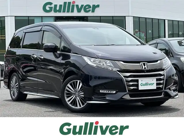 ホンダ オデッセイ ハイブリッド アブソルート ホンダセンシング 島根県 2020(令2)年 2.9万km プレミアムヴィーナスブラックP 純正9インチナビ/CD/DVD/DTV/Bluetooth/HDMI/USB/マルチビューカメラ /純正フリップダウンモニター/レーダークルーズコントロール/両側パワースライドドア/コーナーセンサー /LEDオートライト/ステアリングスイッチ/電子パーキング/ハーフレザー調シート/パワーシート/スマートキー/プッシュスタート /純正フロアマット/ドアバイザー