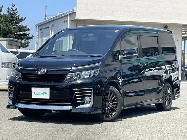 トヨタ ヴォクシー ZS 宮城県 2014(平26)年 11.4万km ブラック ワンオーナー/社外ナビ/Bluetooth/CD・DVD/SD/HDMI/純正アルミホイール16インチ/社外アルミホイール16インチ/ビルトインETC/後席サンシェード/両側パワースライドドア/フロントワイパーデアイサー/アイドリングストップ/横滑り防止/プッシュスタート