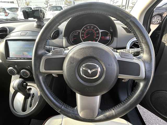 マツダ デミオ SPORT 岡山県 2009(平21)年 6.9万km ラディアントエボニーマイカ ＭＴモード付ＡＴパドルシフト／盗難防止装置／フルフラットシート／ＡＡＣ／ナビでＤＶＤ再生可能／Ｂｌｕｅｔｏｏｔｈ接続／パワーステアリング／パワーウィンドウ
