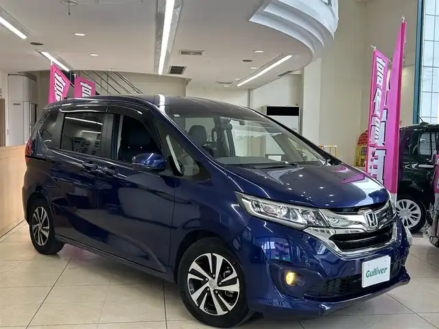 ホンダ フリード G ホンダセンシング 東京都 2017(平29)年 4.5万km コバルトブルーパール ワンオーナー/純正ナビ/（VXM-174VFXI）/（CD/DVD/フルセグ/Bluetooth）/バックカメラ/F/Rコーナーセンサー/ブラックハーフレザーシート/両側パワースライドドア/レーダークルーズ/プリクラッシュセーフティ/LKA/スマートキー/プッシュスタート/スペアキー/ドラレコ/（ND-DVR10）/オートライト/LEDヘッドライト/純正フォグライト/革巻きステアリング/ステアリングスイッチ/リアロールサンシェード/ISOFIX/リアプライバシーガラス/電動格納ウィンカーミラー/AC100V/アイドリングストップ/ETC/バイザー/純正15インチアルミホイール/W+サイド+カーテンSRS&ABS/横滑防止装置/新車時保証書/取扱説明書
