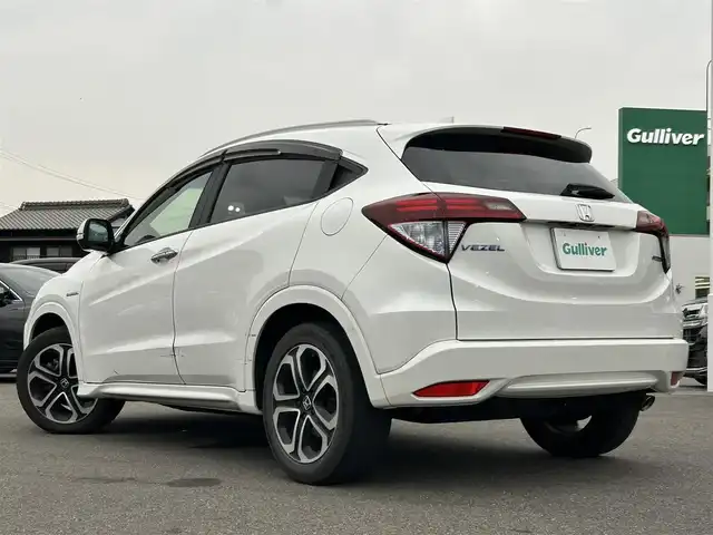 ホンダ ヴェゼル ハイブリッド Z 愛知県 2015(平27)年 10.1万km ホワイトオーキッドパール ワンオーナー/SDナビ（BT/SD/FM/AM/DVD/CD)/ワンセグTV/バックカメラ/LEDヘッドライト/フォグランプ/ETC/プッシュスタート/運転席＆助手席シートヒーター/パドルシフト/革ステアリング/ルーフレール/純正17インチAW/スマートキー/スペアキー