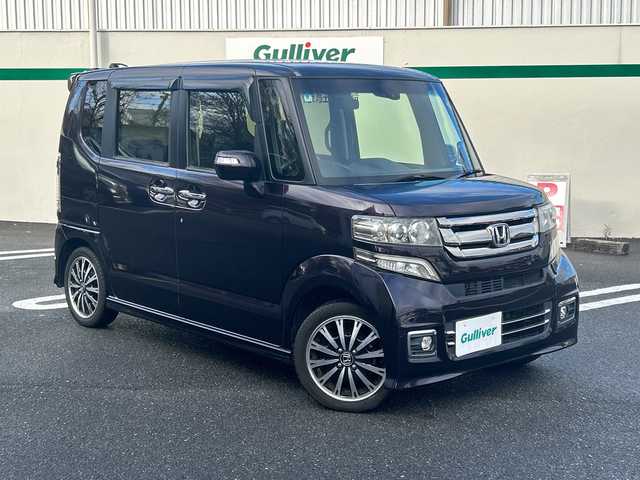 ホンダ Ｎ ＢＯＸ カスタム G ターボ Lパッケージ 東京都 2016(平28)年 7.3万km プレミアムベルベットパープル・パール GathersフルセグTVナビ（VXM-175VFNi）/・Bluetooth/AUX/USB/純正15インチアルミホイール/純正フロアマット/バックカメラ/ETC/両側パワースライドドア/横滑り防止装置/盗難防止装置/ドアバイザー/オートライト/後席サンシェード/プッシュスタート/後席チップアップシート/スマートキー/スペアキー1本/保証書