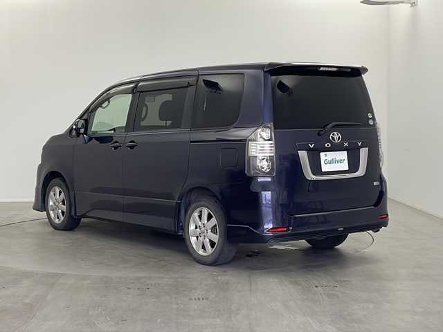 トヨタ ヴォクシー ZS 栃木県 2007(平19)年 17.6万km ダークバイオレットマイカメタリック 社外7インチナビ/AM FM CD DVD HDD AUX フルセグTV/ETC/フリップダウンモニター/両側パワースライドドア/パドルシフト/オートエアコン/フォグランプ/電動格納ミラー/スマートキー×2/純正マット/純正アルミホイール