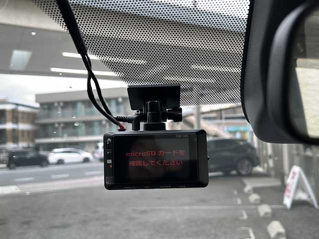 トヨタ ノア ハイブリッド Z 兵庫県 2024(令6)年 1.4万km アティチュードブラックマイカ ワンオーナー/純正ディスプレイオーディオ　Bluetooth/AppleCarPlay/AndroldAuto/USB//AM/FM//純正ETC2.0/ドライブレコーダー（前後）/3列シート/両側パワースライドドア/純正フロアマット/シートヒーター（D+N席）/シートバックテーブル/ハーフレザーシート/１００V充電/Wエアコン/アダプティブクルーズコントロール/アンチロック・ブレーキ・システム/アイドリングストップ/レーンキープアシスト/コーナーセンサー（前後）/横滑り防止装置/盗難防止装置/パワーステアリング/パワーウィンドウ/バックカメラ/オートライト/オートマチックハイビーム/エアバッグ（W+サイド）/カーテンエアバッグ/スペアキー（1本）/保証書/取扱説明書
