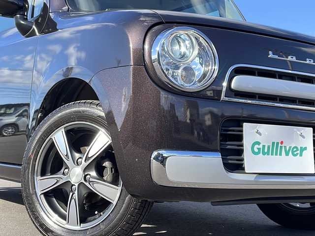 スズキ ラパン ショコラ X 道北・旭川 2014(平26)年 3.7万km アーバンブラウンパールメタリック /4WD//禁煙車//純正メモリナビ//BT/SD/AUX/1セグ//バックカメラ//アイドリングストップ//合皮シート//シートヒーター//ミラーヒーター//オートライト//HIDヘッドライト//エンジンスターター//プッシュスタート//スマートキー//純正フロアマット//ドアバイザー