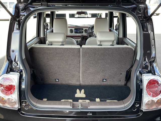 スズキ ラパン ショコラ X 道北・旭川 2014(平26)年 3.7万km アーバンブラウンパールメタリック /4WD//禁煙車//純正メモリナビ//BT/SD/AUX/1セグ//バックカメラ//アイドリングストップ//合皮シート//シートヒーター//ミラーヒーター//オートライト//HIDヘッドライト//エンジンスターター//プッシュスタート//スマートキー//純正フロアマット//ドアバイザー