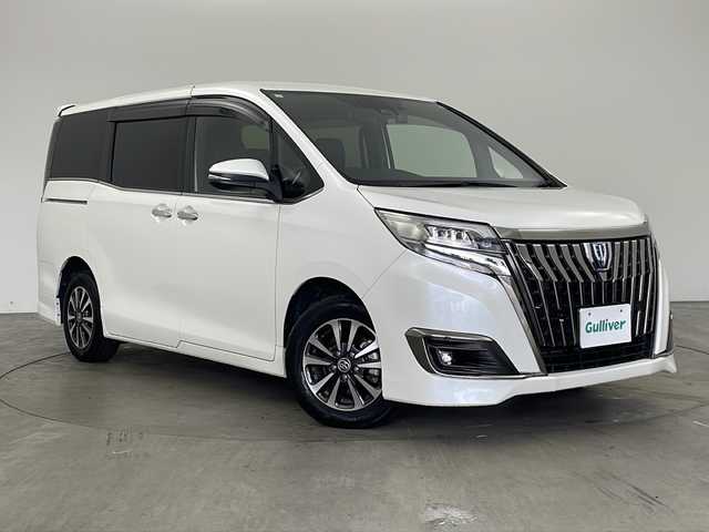 トヨタ エスクァイア ハイブリッド Gi プレミアムパッケージ ブラックテーラード 兵庫県 2021(令3)年 5.8万km ホワイトパールクリスタルシャイン ・社外9インチSDナビ（X9NX）/CD/DVD/SD/BT/フルセグ/・バックカメラ/・ビルトインETC/・Toyota　Safety　Sense/プリクラッシュセーフティ/レーンディパチャーアラート/オートマチックハイビーム/先行車発進告知/・クルーズコントロール/・横滑り防止装置/・パーキングサポートブレーキ/・車両接近通報装置/・両側パワースライドドア/・ステアリングスイッチ/・ステアリングヒーター/・合皮シート/・前席シートヒーター/・純正フロアマット/・ＬＥＤヘッドライト/・オートライト/・純正15インチアルミホイール/・ドライブレコーダー/・スマートキー/・スペアキー/・クリアランスソナー/・取扱説明書/・保証書