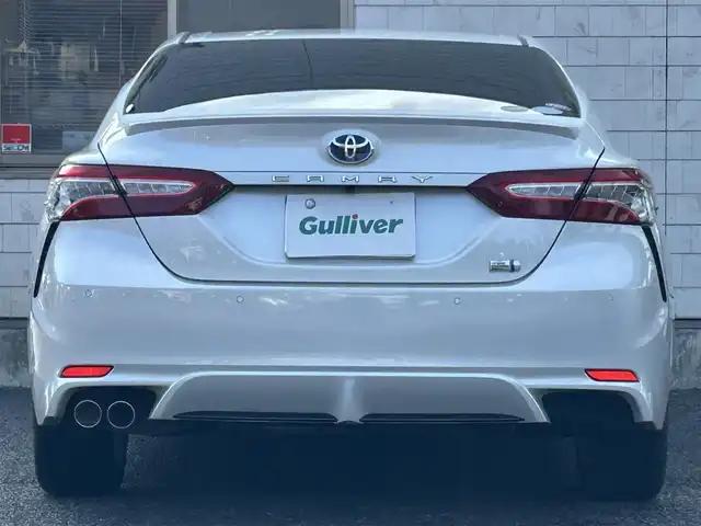 トヨタ カムリ WS 福岡県 2019(令1)年 4.7万km プラチナホワイトパールマイカ 純正7インチメモリナビ/　（AM/FM/CD/DVD/Bluetooth/フルセグTV）/バックカメラ/トヨタセーフティセンス/・プリクラッシュセーフティシステム/・レーンディバーチャーアラート/・オートマチックハイビーム/・レーダークルーズコントロール/オートライト/横滑り防止装置/クリアランスソナー/コーナーセンサー/純正17インチAW/黒色ハーフレザーシート/パワーシート（D席）/パドルシフト/ビルトインETC/前方ドライブレコーダー/電格ウインカーミラー/純正フロアマット/ドアバイザー/プッシュスタート/ステアリングスイッチ/ISOFIX/電源ソケット×1/保証書/取扱説明書