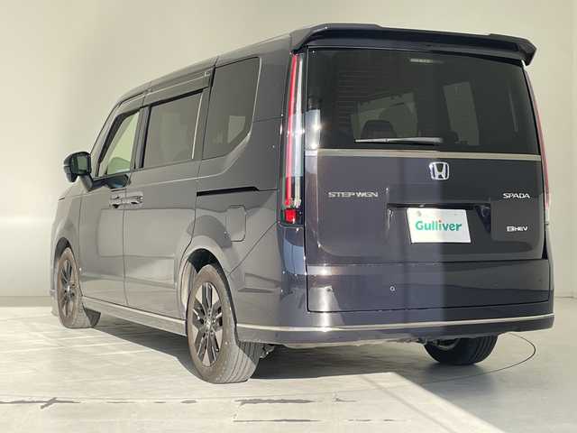 ホンダ ステップワゴン スパーダ eHEV 沖縄県 2024(令6)年 3.5万km トワイライトミストブラックパール 社外ディスプレイオーディオ（Bluetooth）/バックカメラ/ETC/レーダークルーズコントロール/ダウンヒルアシストコントロール/パドルシフト/ステアリングスイッチ/シートヒーター/ハーフレザーシート/両側パワースライドドア/電動リアゲート/プッシュスタート/スマートキー/スペアキー/LEDヘッドライト/オートライト/サンシェード/クリアランスソナー/保証書/取扱説明書