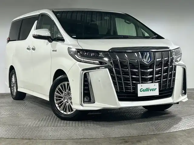 トヨタ アルファードハイブリット SR Cパッケージ 神奈川県 2020(令2)年 6.7万km ホワイトパールクリスタルシャイン 純正メーカーOPナビ　/パノラミックビューモニター　/-Miracast/CD/DVD/Bluetooth/フルセグTV/USB/JBL/両側パワースライドドア/トヨタセーフティセンス　/プリクラッシュセーフティシステム　/レーンディパーチャーアラート　/レーダークルーズコントロール　/前後クリアランスソナー/ワイヤレス充電/レザーシート/シートヒーター＆ベンチレーション　/メモリーシート/前後ドラレコ/電動パーキング/ブレーキホールド/三眼LEDヘッドライト