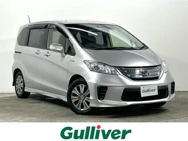 ホンダ フリード ハイブリット ジャストセレクション+ 大阪府 2014(平26)年 2.8万km スーパープラチナメタリック 純正ナビ(フルセグ/DVD再生/Bluetooth) バックカメラ ETC クルコン 両側パワースライドドア オートライト ハーフレザー HIDヘッドライト スマートキー