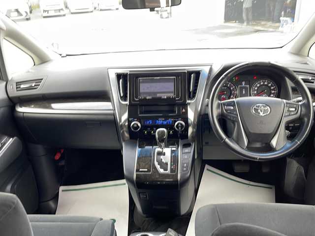 トヨタ ヴェルファイア Z Aエディション 山梨県 2015(平27)年 7.9万km ホワイトパールクリスタルシャイン 社外7ナビ/Bluetooth/バックカメラ/クルーズコントロール/フリップダウンモニター/両側パワースライドドア/横滑り防止装置/ETC/アイドリングストップ/LEDヘッドライト/オートライト/純正18インチAW/プッシュスタート/スマートキー/フロアマット/スペアキー/取扱説明書/保証書