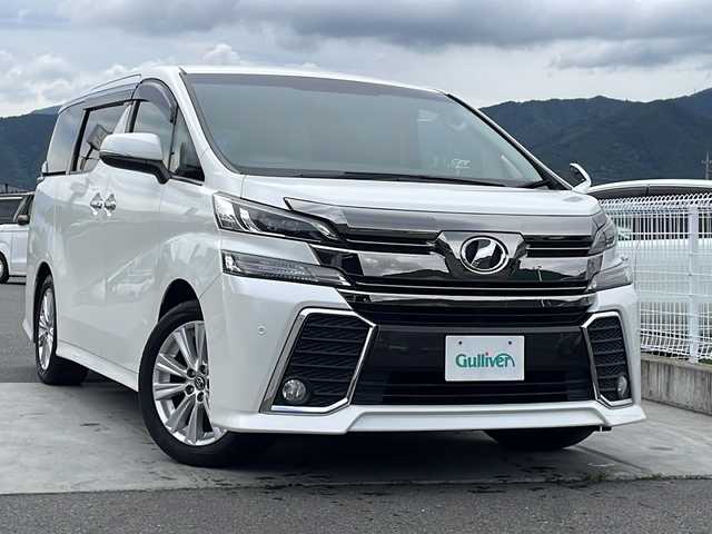 トヨタ ヴェルファイア Z Aエディション 山梨県 2015(平27)年 7.9万km ホワイトパールクリスタルシャイン 社外7ナビ/Bluetooth/バックカメラ/クルーズコントロール/フリップダウンモニター/両側パワースライドドア/横滑り防止装置/ETC/アイドリングストップ/LEDヘッドライト/オートライト/純正18インチAW/プッシュスタート/スマートキー/フロアマット/スペアキー/取扱説明書/保証書