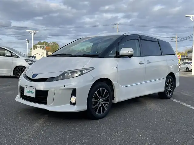 トヨタ エスティマ ハイブリッド アエラス 青森県 2013(平25)年 11.4万km ホワイトパールクリスタルシャイン 禁煙/純正ナビ/CD/DVD/DTV/Bluetooth/バックカメラ/両側パワースライドドア/社外AW付スタッドレス積み込み/HIDオートライト/クルーズコントロール/コーナーセンサー/パワーシート/パワーバックドア/スマートキー/プッシュスタート/純正フロアマット/ドアバイザー/ETC