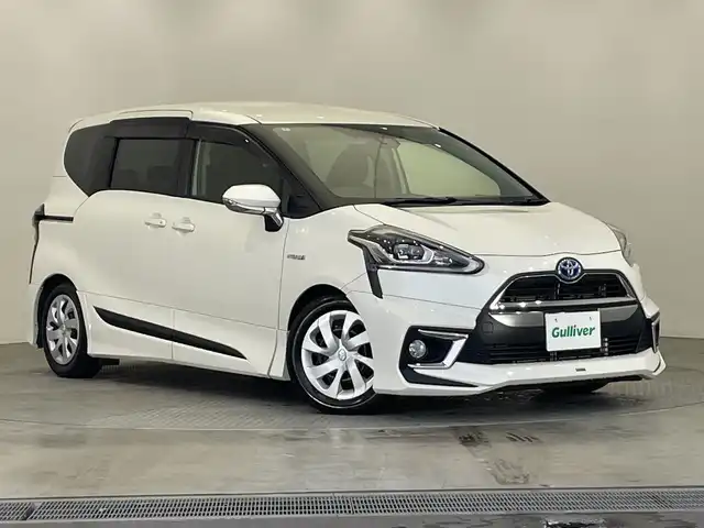トヨタ シエンタ ハイブリッド G クエロ 栃木県 2018(平30)年 2.2万km ホワイトパールクリスタルシャイン モデリスタフルエアロ/アルパインナビ(７WZ)/(フルセグTV・Bluetooth・CD・DVD・SD)/バックカメラ/トヨタセーフティセンス/ ・プリクラッシュセーフティ/ ・レーンキープアシスト/ ・オートハイビーム/両側パワースライドドア/LEDヘッドライト/オートライト/純正フロアマット/ビルトインETC/ドアバイザー/3列シート/スマートキー/禁煙車