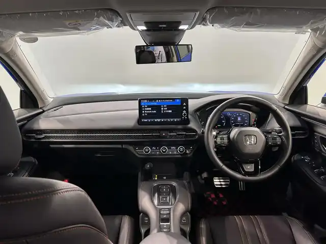 ホンダ ＺＲ－Ｖ ハイブリッド e:HEV Z 愛知県 2023(令5)年 1.2万km プレミアムクリスタルブルークリスタル 純正９型ホンダコネクトナビ　/(FM/AM/USB/Bluetooth/フルセグTV/スマホ連載）/ＢＯＳＥサウンド　/アラウンドビューモニター　/ホンダセンシング　/　　-衝突軽減ブレーキ（CNBS)/　　-誤発進抑制機能/　　-路線逸脱抑制機能/　　-アダプティブクルーズコントロール（ACC)/　　-先行車発進お知らせ機能/　　-標識認識機能/　　-オートハイビーム/　　-ブラインドスポットモニター/　　-パーキングセンサー/ステアリングヒーター　/茶革シート　/ビルトインＥＴＣ２．０　/電動バックドア　/メモリー付パワーシート　/シートヒーター/LEDヘッドライト