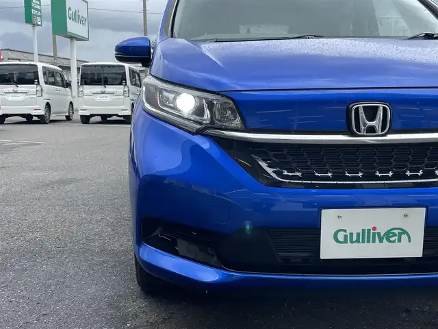 ホンダ フリード ハイブリット G 青森県 2022(令4)年 2.4万km プレミアムクリスタルブルークリスタル ４WD/純正ナビ/フルセグTV/CD/DVD/BT/バックカメラ/ナビ連動型ドライブレコーダー（前後）/スマートキー×２/ETC/両側パワースライドドア/ホンダセンシング/LEDヘッドライト/シートカバー付き