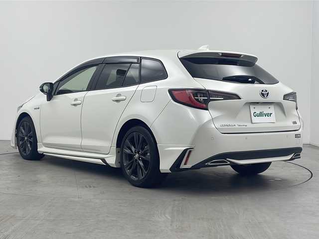 トヨタ カローラツーリング ハイブリッド ダブルバイビー 三重県 2019(令1)年 7.2万km ホワイトパールクリスタルシャイン 禁煙車/純正9インチナビ/（Bluetooth・MiraCast）/バックカメラ/トヨタセーフティセンス/・プリクラッシュセーフティ/・オートマチックハイビーム/・レーントレーシングアシスト/・ロードサインアシスト/・レーダークルーズコントロール/社外フルエアロ/電子パーキング/ブラインドスポットモニター/前席シートヒーター/ステアリングススイッチ/ビルトインETC2.0                                              /スペアタイヤ