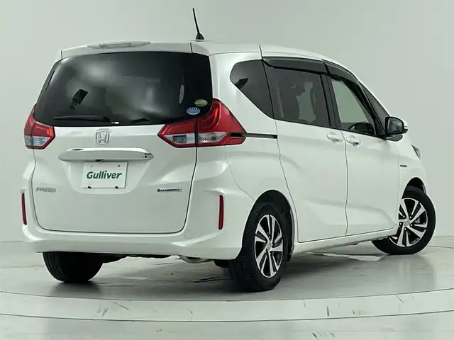 ホンダ フリード ハイブリット EX 大阪府 2018(平30)年 1.2万km ホワイトオーキッドパール ホンダセンシング/　・衝突軽減ブレーキ〈CMBS〉/　・誤発進抑制機能/　・ACC〈アダプティブ・クルーズ・コントロール〉/　・LKAS〈車線維持支援システム〉/　・歩行者事故低減ステアリング/　・路外逸脱抑制機能/　・先行車発進お知らせ機能/　・標識認識機能/純正メモリナビ【CD/DVD/Bluetooth/ワンセグ】/バックカメラ/両側パワースライドドア/ビルトインETC/ハーフレザーシート/シートヒーター/LEDヘッドライト/フォグランプ/コーナーセンサー/スマートキーX2