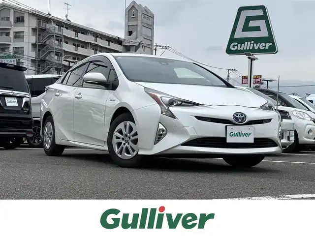 トヨタ プリウス Sセーフティプラス 大分県 2016(平28)年 5.4万km ホワイトパールクリスタルシャイン ・純正ナビ(CD.BT.SD.AUX)/・バックカメラ/・ヘッドアップディスプレイ/・レーダークルーズコントロール/・ワンセグテレビ/・プリクラッシュセーフティ/・ETC/・パーキングアシスト/・コーナーセンサー/・オートハイビーム/・ステアリングリモコン