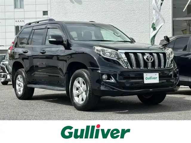 トヨタ ランドクルーザー プラド TX Lパッケージ 愛知県 2016(平28)年 8.3万km ブラック ワンオーナー/4WD/後席フリップダウンモニター/レザーシート/パワーシート/シートヒーター/横滑り防止/純正ビルトインETC/ドアミラーウィンカー/・オートライト/フォグランプ/フロントバンパー（モデリスタ）/保証書/取扱説明書