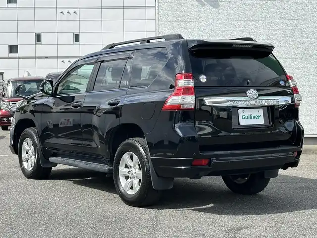 トヨタ ランドクルーザー プラド TX Lパッケージ 愛知県 2016(平28)年 8.3万km ブラック ワンオーナー/4WD/後席フリップダウンモニター/レザーシート/パワーシート/シートヒーター/横滑り防止/純正ビルトインETC/ドアミラーウィンカー/・オートライト/フォグランプ/フロントバンパー（モデリスタ）/保証書/取扱説明書