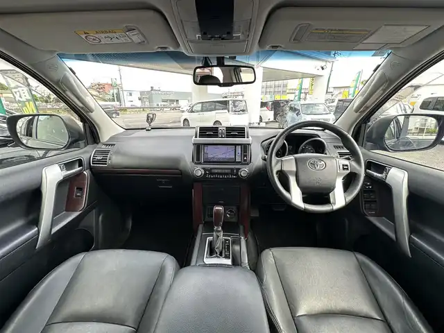 トヨタ ランドクルーザー プラド TX Lパッケージ 愛知県 2016(平28)年 8.3万km ブラック ワンオーナー/4WD/後席フリップダウンモニター/レザーシート/パワーシート/シートヒーター/横滑り防止/純正ビルトインETC/ドアミラーウィンカー/・オートライト/フォグランプ/フロントバンパー（モデリスタ）/保証書/取扱説明書