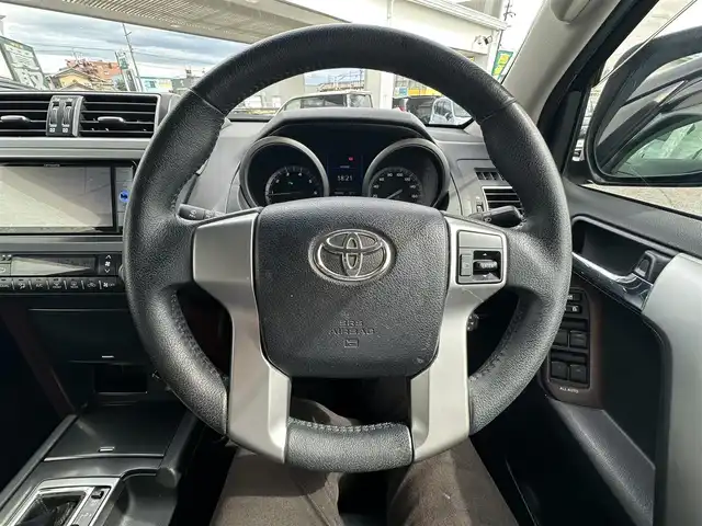 トヨタ ランドクルーザー プラド TX Lパッケージ 愛知県 2016(平28)年 8.3万km ブラック ワンオーナー/4WD/後席フリップダウンモニター/レザーシート/パワーシート/シートヒーター/横滑り防止/純正ビルトインETC/ドアミラーウィンカー/・オートライト/フォグランプ/フロントバンパー（モデリスタ）/保証書/取扱説明書