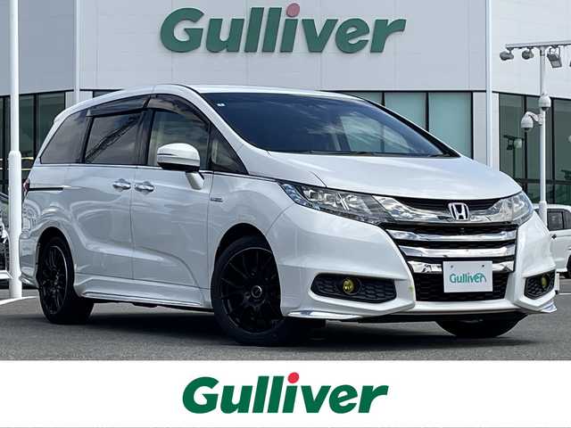 ホンダ オデッセイ ハイブリッド アブソルート・EXホンダセンジング 佐賀県 2016(平28)年 6.6万km ホワイトオーキッドパール 本革シート/純正メモリーナビゲーション/・フルセグTV/CD/DVD/USB/HDMI/Bluetooth/リヤエンターテイメントシステム/マルチビューカメラ/前方ドライブレコーダー/ビルトインETC/両側パワースライドドア/100V電源/後席エアコン/DN席シートヒーター/キャプテンシート/オットマン/後席サンシェード/ISOFIX対応/革巻きステアリング/ステアリングリモコン/RAYS18インチアルミホイール/純正LEDヘッドライト/純正フォグランプ/純正フロアマット/ドアバイザ―/新車保証書/取扱説明書/ホンダセンシング/・アダプディブクルーズコントロール/・衝突被害軽減ブレーキ/・先行車発進お知らせ機能/・路外逸脱抑制機能/・ブラインドスポットインフォメーション/・標識認識機能