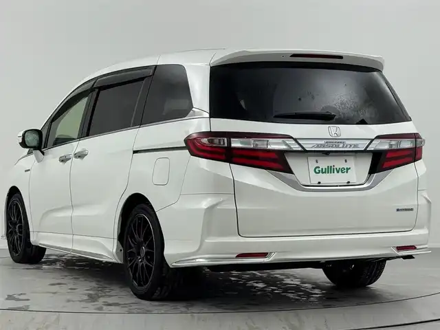 ホンダ オデッセイ ハイブリッド アブソルート・EXホンダセンジング 熊本県 2016(平28)年 6.6万km ホワイトオーキッドパール 本革シート/純正メモリーナビゲーション/・フルセグTV/CD/DVD/USB/HDMI/Bluetooth/リヤエンターテイメントシステム/マルチビューカメラ/前方ドライブレコーダー/ビルトインETC/両側パワースライドドア/100V電源/後席エアコン/DN席シートヒーター/キャプテンシート/オットマン/後席サンシェード/ISOFIX対応/革巻きステアリング/ステアリングリモコン/RAYS18インチアルミホイール/純正LEDヘッドライト/純正フォグランプ/純正フロアマット/ドアバイザ―/新車保証書/取扱説明書/ホンダセンシング/・アダプディブクルーズコントロール/・衝突被害軽減ブレーキ/・先行車発進お知らせ機能/・路外逸脱抑制機能/・ブラインドスポットインフォメーション/・標識認識機能