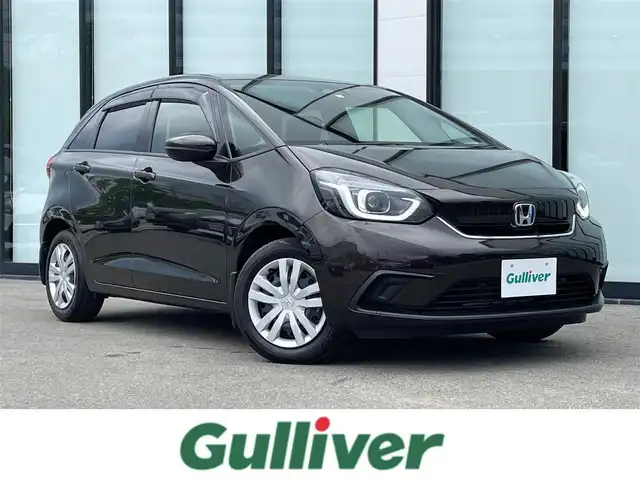 ホンダ フィット e:HEVホーム 大阪府 2020(令2)年 3.8万km プレミアムグラマラスブロンズP 純正８インチナビ/  フルセグTV/CD/DVD/Bluetooth/USB/バックモニター/横滑り防止装置/衝突軽減ブレーキ/コーナーセンサー/レーダークルーズコントロール/レーンキープアシスト/ステアリングスイッチ/アイドリングストップ/オートマチックハイビーム/純正15インチアルミホイール/ハーフレザーシート/純正フロアマット/プッシュスタート/スマートキー/ＥＴＣ/ＬＥＤライト/禁煙車