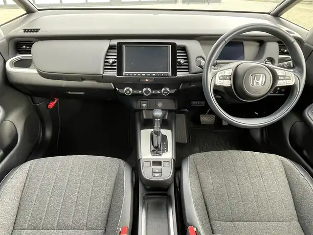 ホンダ フィット e:HEVホーム 大阪府 2020(令2)年 3.8万km プレミアムグラマラスブロンズP 純正８インチナビ/  フルセグTV/CD/DVD/Bluetooth/USB/バックモニター/横滑り防止装置/衝突軽減ブレーキ/コーナーセンサー/レーダークルーズコントロール/レーンキープアシスト/ステアリングスイッチ/アイドリングストップ/オートマチックハイビーム/純正15インチアルミホイール/ハーフレザーシート/純正フロアマット/プッシュスタート/スマートキー/ＥＴＣ/ＬＥＤライト/禁煙車