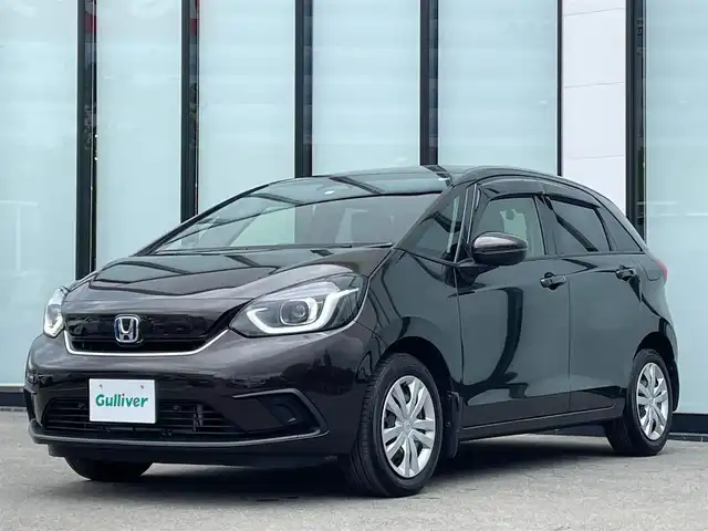 ホンダ フィット e:HEVホーム 大阪府 2020(令2)年 3.8万km プレミアムグラマラスブロンズP 純正８インチナビ/  フルセグTV/CD/DVD/Bluetooth/USB/バックモニター/横滑り防止装置/衝突軽減ブレーキ/コーナーセンサー/レーダークルーズコントロール/レーンキープアシスト/ステアリングスイッチ/アイドリングストップ/オートマチックハイビーム/純正15インチアルミホイール/ハーフレザーシート/純正フロアマット/プッシュスタート/スマートキー/ＥＴＣ/ＬＥＤライト/禁煙車