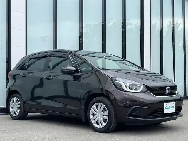 ホンダ フィット e:HEVホーム 大阪府 2020(令2)年 3.8万km プレミアムグラマラスブロンズP 純正８インチナビ/  フルセグTV/CD/DVD/Bluetooth/USB/バックモニター/横滑り防止装置/衝突軽減ブレーキ/コーナーセンサー/レーダークルーズコントロール/レーンキープアシスト/ステアリングスイッチ/アイドリングストップ/オートマチックハイビーム/純正15インチアルミホイール/ハーフレザーシート/純正フロアマット/プッシュスタート/スマートキー/ＥＴＣ/ＬＥＤライト/禁煙車
