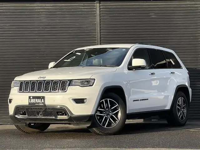 クライスラー・ジープ ジープ グランドチェロキー LTD 山梨県 2019(平31)年 6.5万km ブライトホワイト 後期　/黒革　/ＡＣＣ　/８．４ＵＣナビ　/Ｂカメラ　/フルセグＴＶ　/ＢＴ　/ＵＳＢ　/ステアリングＨ　/ＬＫＡ　/ＢＳＡ　/カープレイ　/ＨＩＤ　/Ａライト　/シートＨ　/ベンチＬ　/エアサス　/Ａブレーキアシスト　/保証書