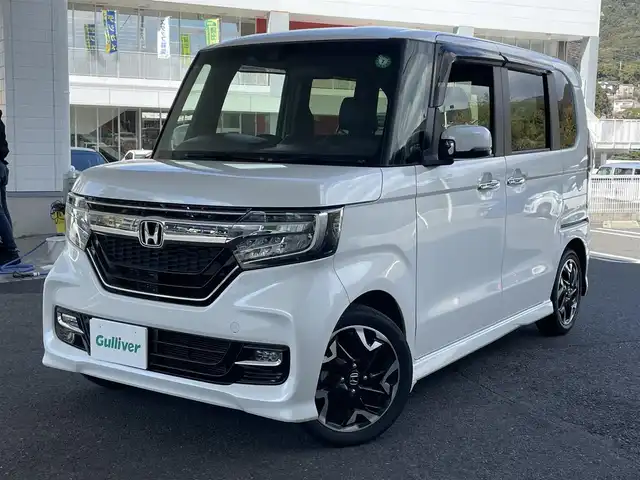 ホンダ Ｎ ＢＯＸ カスタム G EX ターボ ホンダセンシング 佐賀県 2019(令1)年 0.8万km プラチナホワイトパール プッシュスタート/両側パワースライドドア/横滑り防止/レーンキープアシスト/衝突軽減ブレーキ/ビルトインETC/ステアリングスイッチ/革巻きステアリング/パドルシフト/レーダークルーズコントロール/シートヒーター/純正SDナビ(AM/FM/CD/DVD/TV/BT)/純正フロアマット(MUGEN)/オートライト/リアサンシェード/アイドリングストップ/取扱説明書ナビ取扱説明書/保証書