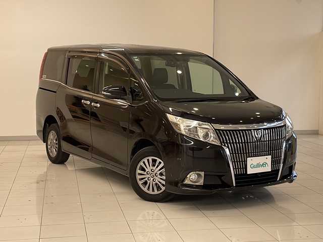 トヨタ エスクァイア Gi 新潟県 2015(平27)年 6.2万km スパークリングブラックパールクリスタルシャイン 4WD/純正9インチSDナビ(NSZT-Y64T)/CD/DVD/BT/フルセグテレビ/フロント/バックカメラ/ETC/フリップダウンモニター/ドライブレコーダー/クルーズコントロール/両側パワースライドドア/革シート/シートヒーター /ステアリングスイッチ/スマートキー/プッシュスタート/LEDヘッドライト/オートライト/オートハイビーム/フォグランプ/純正15インチアルミホイール