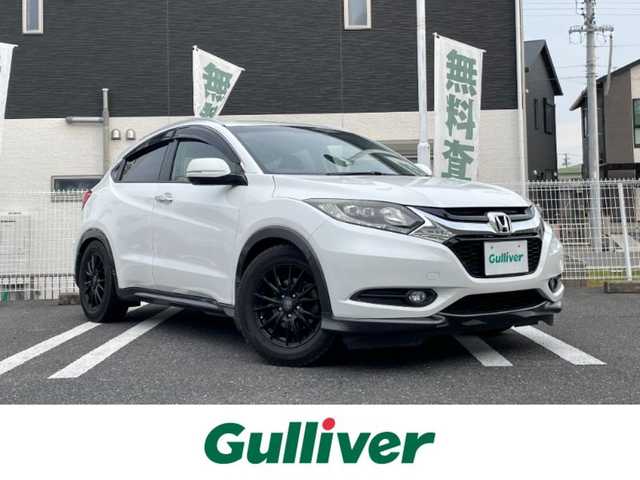 ホンダ ヴェゼル S 三重県 2014(平26)年 14万km ホワイトオーキッドパール 登録時139966km/禁煙車/ハーフレザーシート/純正ナビ/（AM/FM/TV/Bluetooth/CD/DVD）/ワンセグＴＶ/バックカメラ/ＥＴＣ/クルーズコントロール/ステアリングスイッチ/パドルシフト/アイドリングストップ/前後ドラレコ/純正フロアマット/スペアキー/オートライト