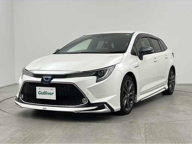 トヨタ カローラツーリング ハイブリッド ダブルバイビー 三重県 2019(令1)年 4.3万km ホワイトパールクリスタルシャイン 禁煙車　/純正９インチナビ機能つきディスプレイオーディオ　/バックカメラ　/モデリスタフルエアロ　/トヨタセーフティセンス　/衝突被害軽減ブレーキ　/レーンキープアシスト　/オートハイビーム　　/純正ビルトインＥＴＣ/オートAC/電子サイドブレーキ/ブレーキオートホールド/ステアリングスイッチ
