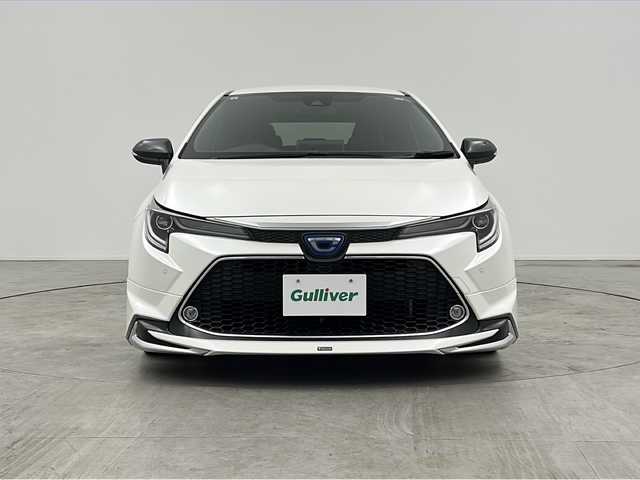 トヨタ カローラツーリング ハイブリッド ダブルバイビー 三重県 2019(令1)年 4.3万km ホワイトパールクリスタルシャイン 禁煙車　/純正９インチナビ機能つきディスプレイオーディオ　/バックカメラ　/モデリスタフルエアロ　/トヨタセーフティセンス　/衝突被害軽減ブレーキ　/レーンキープアシスト　/オートハイビーム　　/純正ビルトインＥＴＣ/オートAC/電子サイドブレーキ/ブレーキオートホールド/ステアリングスイッチ