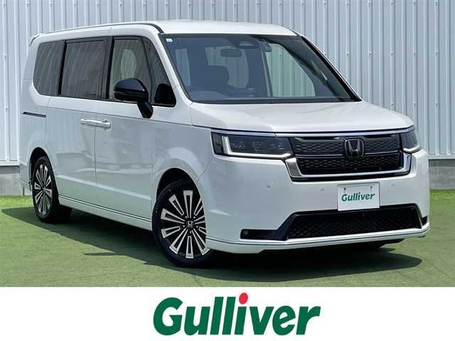 ホンダ ステップワゴン スパーダ プレミアムライン 香川県 2023(令5)年 1.7万km プラチナホワイトパール 登録時走行距離：17082km/純正11.4型ナビ/　CD DVD BT フルセグTV/全方位カメラ/両側パワースライドドア/パワーバックドア/衝突被害軽減装置/レーンキープアシスト/レーダークルーズコントロール/LEDヘッドライト/オートライト/フォグランプ/横滑り防止装置/アイドリングストップ/オートホールド機能付き電子パーキングブレーキ/ハーフレザーシート/シートヒーター/ドライブレコーダー/ビルトインETC/ロールサンシェード/ISOFIX/プッシュスタート/スマートキー