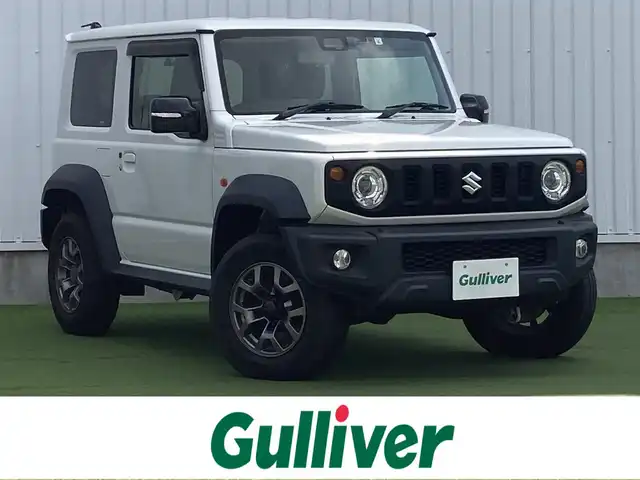 スズキ ジムニー シエラ JC 香川県 2019(平31)年 3.5万km ピュアホワイトP 登録時走行距離34657km/BLIZZAK製タイヤ【DM-V3】/純正アルミホイール付サマータイヤ積み込み/純正8型SDナビ【CN-RZ843】/（フルセグTV/Bluetooth/DVD）/バックカメラ/前後ドライブレコーダー【ZDR-015】/前席シートヒーター/スズキセーフティサポート/クルーズコントロール/LEDヘッドライト/フォグライト/純正ビルトインETC/社外アームレスト/OPドリンクホルダー/革巻きステアリング/ステアリングスイッチ/背面タイヤ（カバー付）/ヒーテッドドアミラー/ウィンカー付電動格納ミラー
