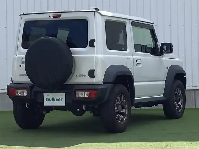 スズキ ジムニー シエラ JC 香川県 2019(平31)年 3.5万km ピュアホワイトP 登録時走行距離34657km/BLIZZAK製タイヤ【DM-V3】/純正アルミホイール付サマータイヤ積み込み/純正8型SDナビ【CN-RZ843】/（フルセグTV/Bluetooth/DVD）/バックカメラ/前後ドライブレコーダー【ZDR-015】/前席シートヒーター/スズキセーフティサポート/クルーズコントロール/LEDヘッドライト/フォグライト/純正ビルトインETC/社外アームレスト/OPドリンクホルダー/革巻きステアリング/ステアリングスイッチ/背面タイヤ（カバー付）/ヒーテッドドアミラー/ウィンカー付電動格納ミラー