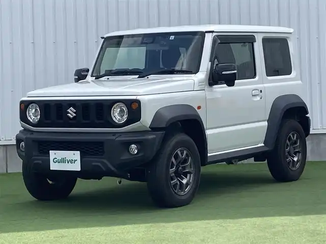 スズキ ジムニー シエラ JC 香川県 2019(平31)年 3.5万km ピュアホワイトP 登録時走行距離34657km/BLIZZAK製タイヤ【DM-V3】/純正アルミホイール付サマータイヤ積み込み/純正8型SDナビ【CN-RZ843】/（フルセグTV/Bluetooth/DVD）/バックカメラ/前後ドライブレコーダー【ZDR-015】/前席シートヒーター/スズキセーフティサポート/クルーズコントロール/LEDヘッドライト/フォグライト/純正ビルトインETC/社外アームレスト/OPドリンクホルダー/革巻きステアリング/ステアリングスイッチ/背面タイヤ（カバー付）/ヒーテッドドアミラー/ウィンカー付電動格納ミラー