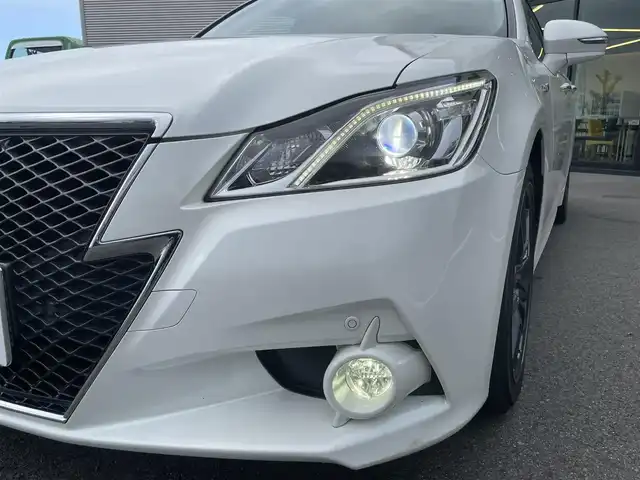 トヨタ クラウン ハイブリッド アスリートS 愛媛県 2014(平26)年 8.7万km ホワイトパールクリスタルシャイン サンルーフ/純正HDDナビ/（Bluetooth/CD/DVD/USB/フルセグTV）/TVキャンセラー/ビルトインETC/ガイド付きバックカメラ/前方ドライブレコーダー/前席パワーシート/衝突被害軽減システム/クリアランスソナー /レーダークルーズコントロール/前席シートヒーター/ステアリングヒーター/ZACKJP-520/18インチAW/社外GPSレーダー/純正フロアマット/ABS/横滑り防止装置/前後コーナーセンサー/盗難防止装置/カーテンエアバック/LEDヘッドライト/フォグランプ/オートライト