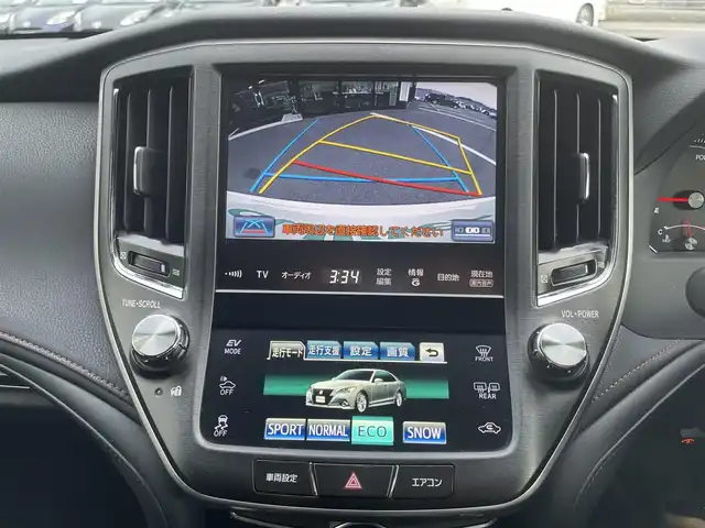 トヨタ クラウン ハイブリッド アスリートS 愛媛県 2014(平26)年 8.7万km ホワイトパールクリスタルシャイン サンルーフ/純正HDDナビ/（Bluetooth/CD/DVD/USB/フルセグTV）/TVキャンセラー/ビルトインETC/ガイド付きバックカメラ/前方ドライブレコーダー/前席パワーシート/衝突被害軽減システム/クリアランスソナー /レーダークルーズコントロール/前席シートヒーター/ステアリングヒーター/ZACKJP-520/18インチAW/社外GPSレーダー/純正フロアマット/ABS/横滑り防止装置/前後コーナーセンサー/盗難防止装置/カーテンエアバック/LEDヘッドライト/フォグランプ/オートライト