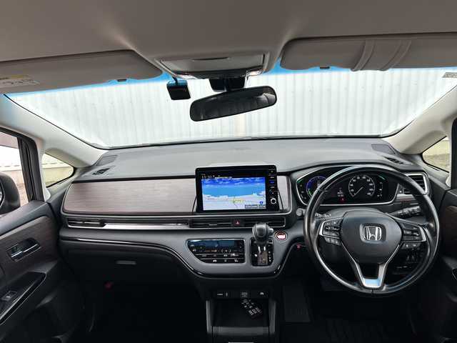 ホンダ オデッセイ ハイブリッド e:HEVアブソルート EX 愛媛県 2020(令2)年 5.1万km プレミアムスパークルブラックパール 純正ナビ/フリップダウンモニター/全方位カメラ/両側パワースライドドア/ブラインドスポットモニター/ビルトイン2.0ETC/ドライブレコーダー前後/衝突軽減システム/電動リアゲート/コーナーセンサー前後/オットマン/クルーズコントロール追従あり/合皮シート/シートヒーター/オートライトLED/レーンキープアシスト/ウォークスルー/パワーシート/フォグランプ